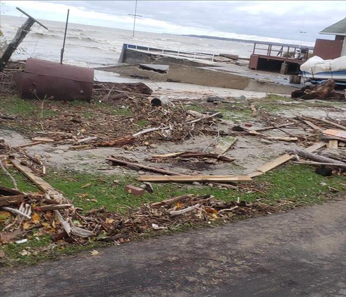Debris washed up on the lawn of a lakeside home after a severe storm in Western New York.