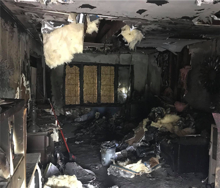living room destroyed by fire black walls