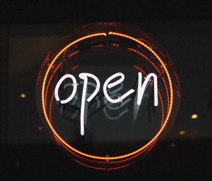 White and orange neon "Open" sign.